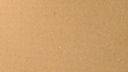 Background of brown kraft paper or cardboard texture. Abstract pattern of beige rough carton, old paper sheet, parchment or papyrus surface.