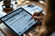© Markus Schröder - Employee filling out digital incident report on company tablet after workplace safety inspection part of iso procedure and audit trail