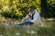 © andrew_shots - Adult father and little daughter are walking in the park