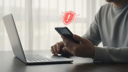 A man holding a smartphone and showing a red scam notification symbol for scam alert warning, fraud alert, email spam issues.