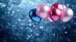 © Sudarat - Colorful Glitter Balloons on a Shimmering Blue Background