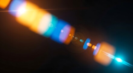 Canvas Print - Abstract colorful lens flare with bright orange and blue light streaks on black background