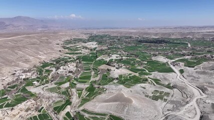 Wall Mural - Aerial Drone View Of Nangarhar Landscape With Green farming Fields, Hills in desert land In Afghanistan, Nuristan.