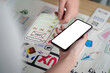 © Natee Meepian - UX UI Design Collaboration with Smartphone and Sketches