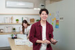 © Natee Meepian - Confident Young Man in UX UI Design Workspace
