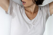 © MarijaBazarova - Woman checking sweat stain under armpit on her t-shirt, concept of excessive sweating, body odor and hyperhidrosis problem in adult female