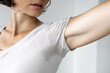 © MarijaBazarova - Woman checking sweat stain under armpit on her t-shirt, concept of excessive sweating, body odor and hyperhidrosis problem in adult female