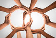 © Puttachat - Business groups Unity and diversity partnership as hands in a group of 2 diverse people community connected together shaped as two support circles symbol of team or teamwork and togetherness.