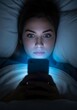 © MdNazim - Young woman illuminated by phone screen light