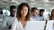 © Natali IQstock - Professional men and women of various ethnic backgrounds, working side by side in bright open office, focused on laptops and tablets. professionals working together, diverse office