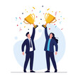 © Muqtadir - Two people in suits celebrating victory holding golden trophies above their heads with confetti falling all around them.