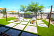© Tom - Rear Yard Conversation Area With Wicker Furniture
