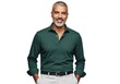 © Alif - Smiling mature man with salt and pepper beard wearing a dark green collared shirt and light pants