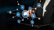 © InfiniteFlow - A business person engages with digital connectivity icons on a tablet, representing advanced technology in data analysis and modern networking in industries. Crux