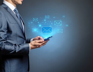 Businessman using smartphone with glowing blue hologram of email message icons, digital communication technology, corporate networking and online business connection concept