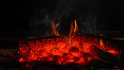 Wall Mural - Seamlessly looping video of warm red glowing embers gently rising and flickering against a dark, smoky backdrop heat, light, flame