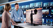 © Andrey Popov - Female Tech Expert Helps Male Customer Choose TV