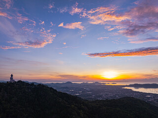 Wall Mural - aerial view A serene landscape capturing the soft hues of dawn as mist settles over distant mountain ranges under a pastel-colored sky. Amazing pink sky at sunrise. gradient color sky texture