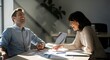 © PIVSON SOLUTION - Joyful colleagues laughing while reviewing documents in a sunlit modern office space