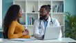 © Pete - Black pregnant woman consults with male doctor about prenatal care in clinic. Smiling mother-to-be talks with physician, obstetrician discusses health, maternity support during appointment, using