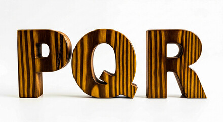 Wooden letters p, q, and r with a rich, dark wood grain pattern stand proudly on a clean white background, showcasing their unique texture and form