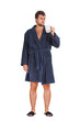 © 1STunningART - Full length portrait of sleepy and upset young man waking up early morning, holding a coffee mug looks confused. Fatigue male wearing bathrobe isolated on transparent background