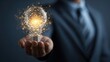 © dimas - Businessman Holding a Lightbulb Idea Concept.