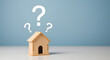 © abeeha - Wooden house with question marks, representing real estate decisions, home ownership, or housing market