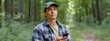 © Wanida - Young Man Using Smartphone in Peaceful Forest Setting
