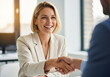 © Jimmy - Happy blonde businesswoman smiling brightly while shaking hands to finalize contract