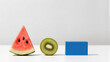 © aviavlad - Bright fruits and a blue block create a fun visual arrangement