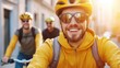 © Wanida - Happy Cyclist in Yellow Jacket Riding with Friends in Urban Setting