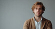 © J. Grayscale - Confident Young Man in Casual Attire Posing Against a Neutral Background