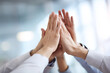 © inas - Team high five gesture symbolizing unity and success