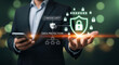 © Shutter Wisp - Businessman holding smartphone with digital security shield and network protection overlay