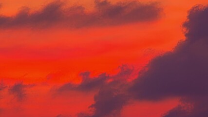 Wall Mural - time lapse Scene of romantic sky sunset with cloud moving in the sky. 
beautiful golden sky at sunset above ocean in nature and travel concept.
sunset landscape Amazing cloudy sky 