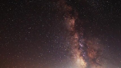 Wall Mural - Starry sky timelapse background. Beautiful night sky with Milky Way galaxy on dark sky.