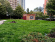 Urban park view in Manchester with greenery and surrounding buildings