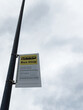Bus stop sign on a pole in Manchester UK indicating school buses only
