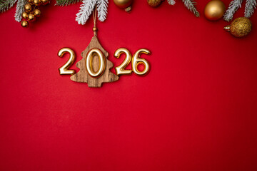 Wall Mural - christmas and happy new year 2026 with gold glitter decorations on red bright background. holiday pa