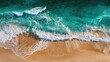 © Dabo - Aerial view Ocean waves crashing on sandy beach at sunset