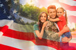 © New Africa - Military man and his family outdoors, double exposure with national flag of USA