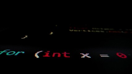 Closeup macro shot movement of coding script moving across LED screen with real-time AI-generated typing, showcasing advanced AI learning in optimization, debug and coding for software development.