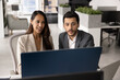 © fizkes - Two young diverse product managers working together at computer