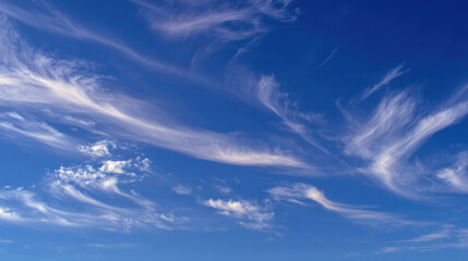 Wall Mural - beautiful sky filled with wispy clouds against vibrant blue backdrop creates serene and peaceful atm