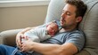 © Audax - A tired new father sleeping in an armchair while holding his sleeping newborn baby.