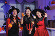 © crizzystudio - Young asian women celebrating halloween party in witch costumes