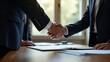 © HaJung - Diplomats Shaking Hands Over Trade Agreement Documents in Formal Negotiations Room - Symbolizing Diplomacy and Trade Partnership with Empty Space for Text