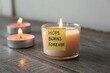 © Haraz - Candle with Hope Burns Forever Message on Wooden Table Surrounded by Tealights Creating a Warm and Inspirational Atmosphere