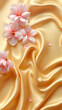 © Muhammad - Soft pink blossoms delicately resting on a luxurious golden silk fabric with gentle folds and highlights